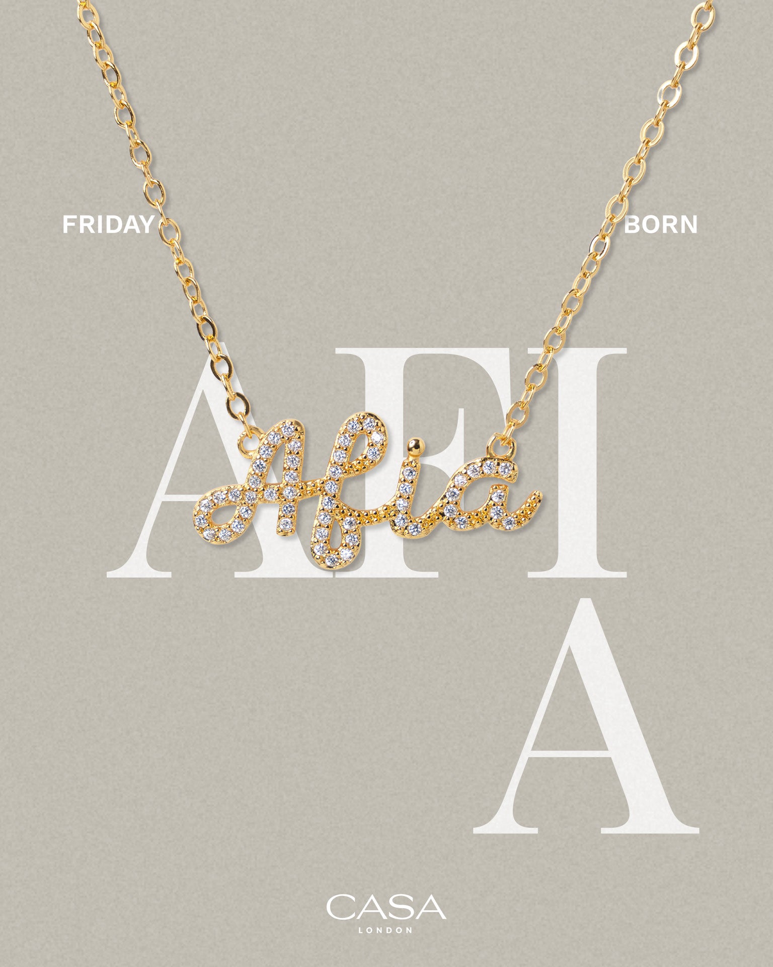 A product shot of CASA London’s 18k gold Afia Pavé Necklace. The delicate gold chain features a script pendant spelling "Afia," encrusted with shimmering pavé-set stones against a neutral, textured background. Overlaid text reads "FRIDAY BORN," highlighting the brand's commitment to celebrating cultural heritage and personal narratives through modern luxury.
