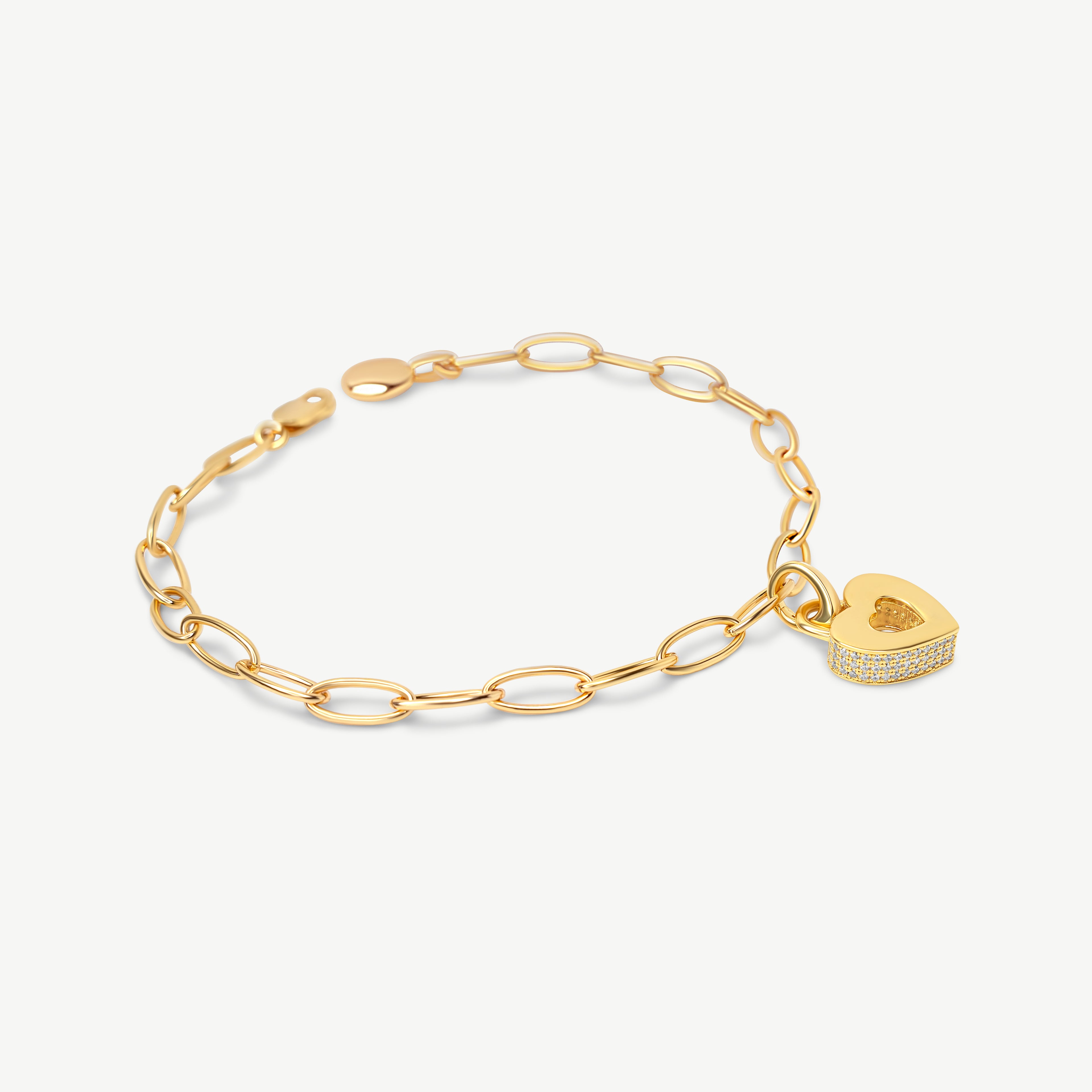 CASA LONDON Akoma Pavé Charm in 18ct gold vermeil styled on the Royal Insignia oval link chain bracelet — heart-shaped Adinkra charm with white zirconia pavé stones, shown on a cream background