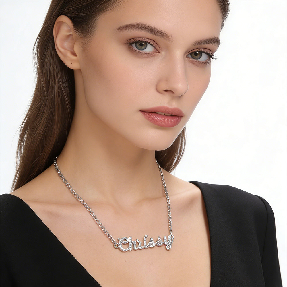 Model wearing the CASA London Custom Pavé Name Necklace in 18ct gold vermeil on S925 sterling silver, worn solo as a statement piece