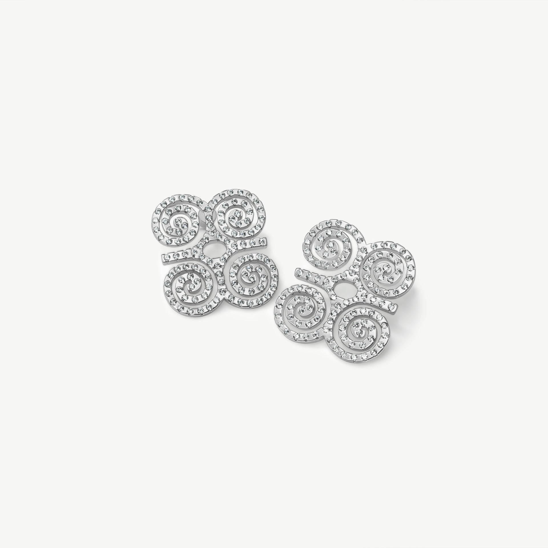 A high-resolution product shot of CASA London’s silver Dwennimmen Pavé Stud Earrings. The pair features the intricate Adinkra symbol of rams' horns—representing strength and humility—meticulously encrusted with shimmering pavé-set stones. Set against a minimalist white background, the design highlights the brand's commitment to merging historic West African artistry with sophisticated, modern luxury.